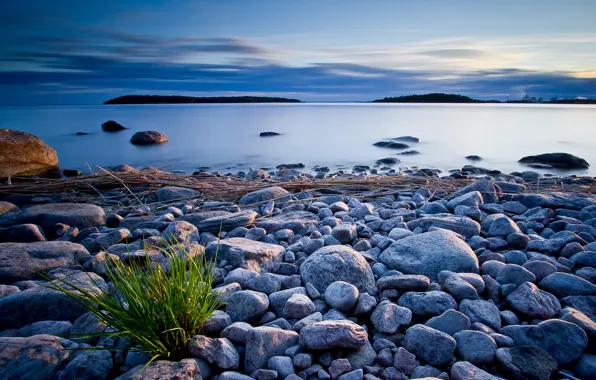 The sky, clouds, lake, stones, shore, the evening