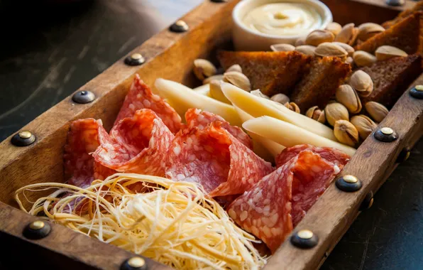 Cheese, bread, nuts, sauce, sausage, pistachios, appetizer
