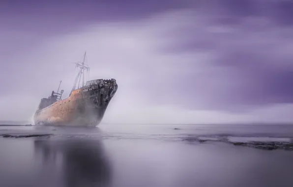 Shore, coast, the freighter, sea. stranded