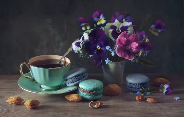 Tea, almonds, forget-me-nots, violet, macaroon
