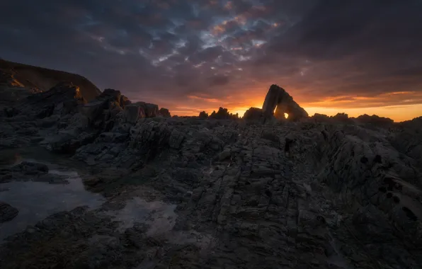The sky, sunset, clouds, rock, stones, rocks, shore, the evening
