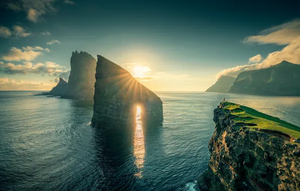 Sea, the sun, rocks, arch