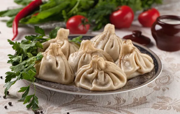 Greens, tomatoes, khinkali