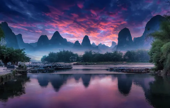 The sky, clouds, sunset, mountains, fog, lake, reflection, rocks