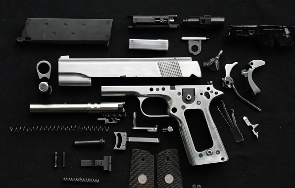 Pistol, screws, springs, disassembled metal parts