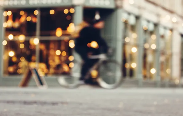 Picture the city, lights, bokeh, velosipedist