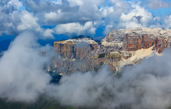 The sky, clouds, mountains, rocks