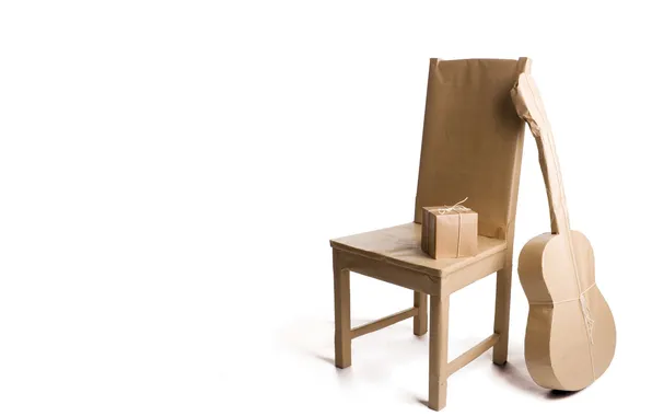 Box, guitar, chair