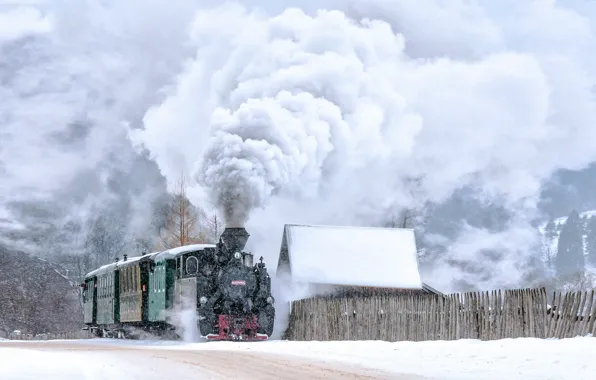 Winter, retro, train, the engine, locomotives, the smoke from the chimney, a peasant triumphant on …
