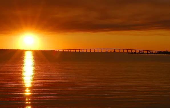 Sea, the sky, the sun, clouds, rays, sunset, bridge