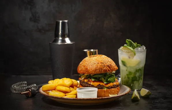 Glass, table, cocktail, lime, hamburger, fries, ice cubes, soft drink