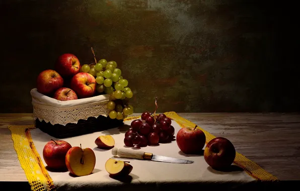 The dark background, table, apples, towel, grapes, knife, fruit, still life
