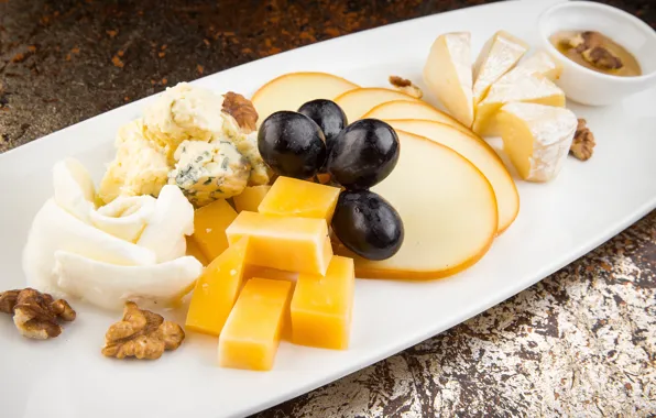 Picture cheese, grapes, nuts, cuts