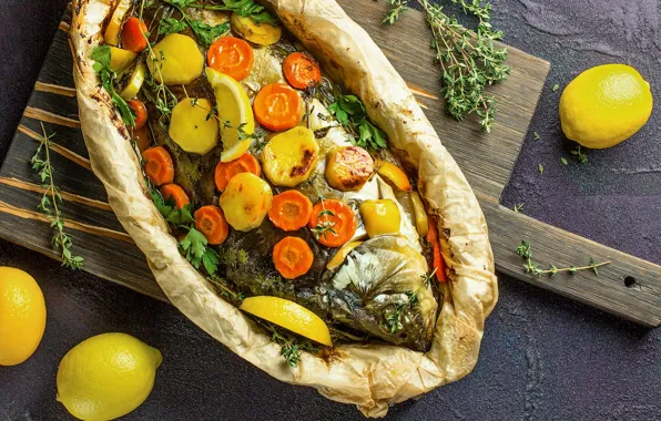 Lemon, fish, carrots, potatoes, baked