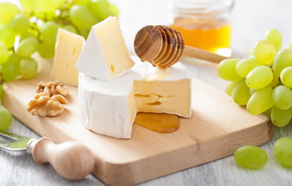 White, cheese, honey, grapes, spoon, knife, Board, nuts
