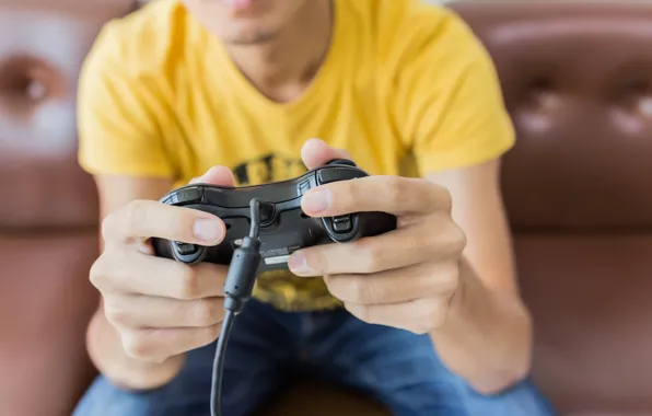 Picture gamer, player, joystick, yellow shirt