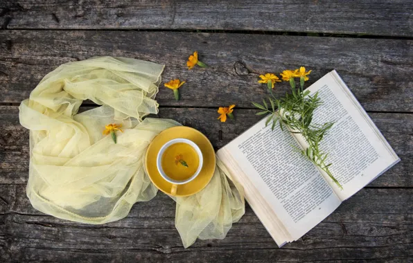 Tea, fabric, book, marigolds