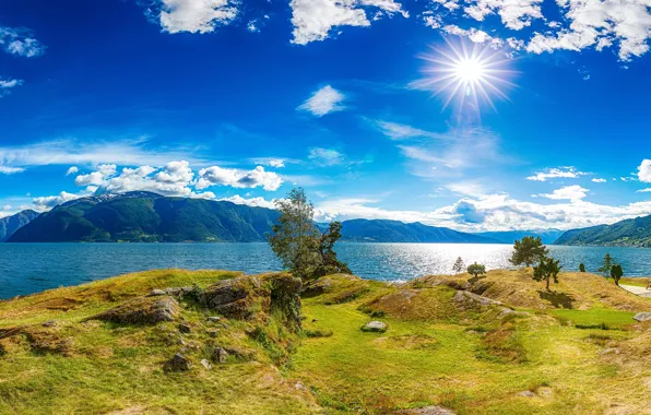 The sky, grass, the sun, clouds, rays, trees, mountains, stones