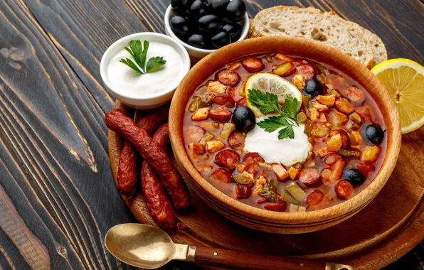 Lemon, soup, olives, sour cream, sausages