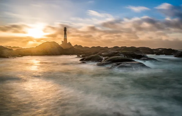 Sea, rocks, lighthouse