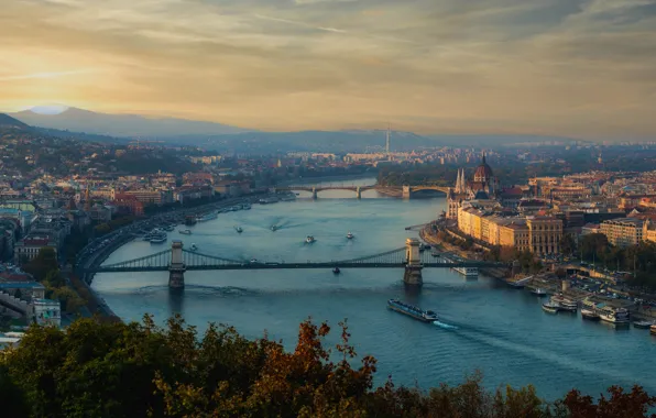 The sky, clouds, trees, mountains, bridge, the city, river, building