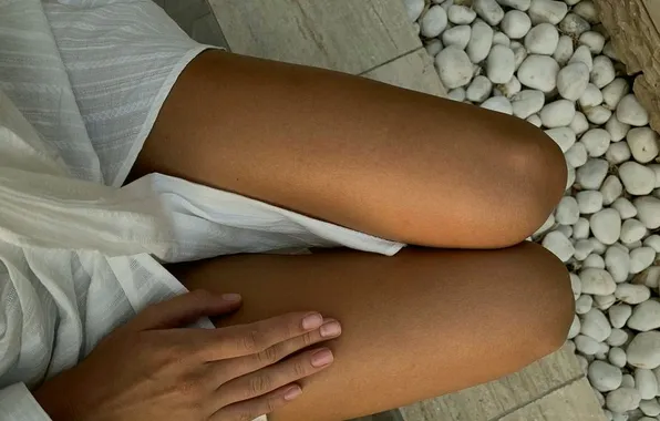 Girl, pebbles, white dress, stones, manicure, slender legs, tanned legs