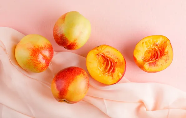 Fruit, peaches, pink background, halves, composition, nectarines