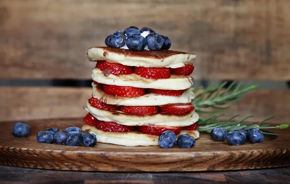 Picture greens, berries, blueberries, strawberry, pancakes