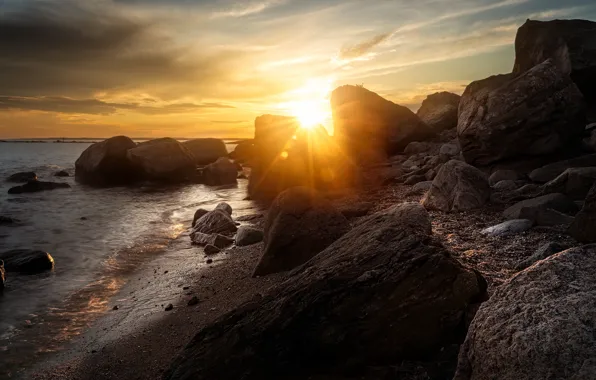Sea, the sun, rays, light, sunset, stones, rocks, shore