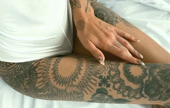 Girl, manicure, slender legs, tattoos on the arm, tattoos on the legs