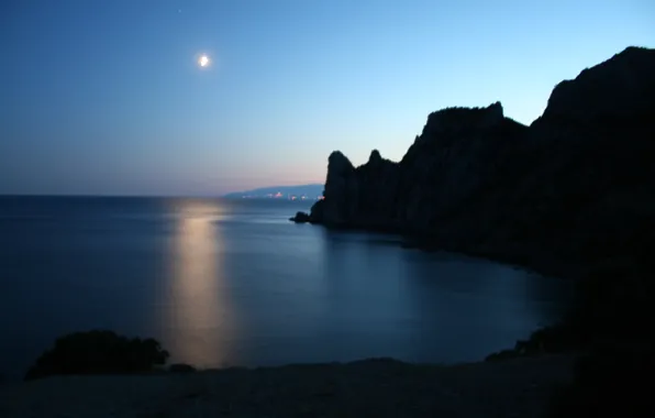 Sea, rocks, the moon