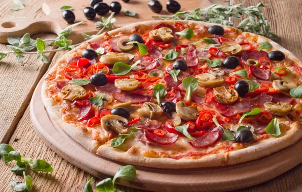 Greens, mushrooms, cheese, pepper, pizza, olives, sausage
