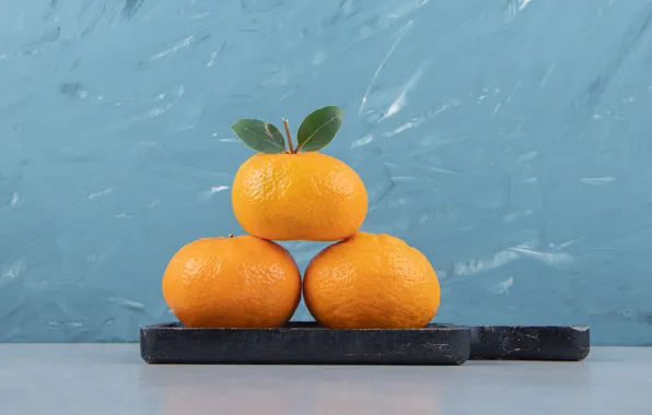 Fruit, leaves, trio, citrus, blue background, tangerines, cutting Board, three tangerines