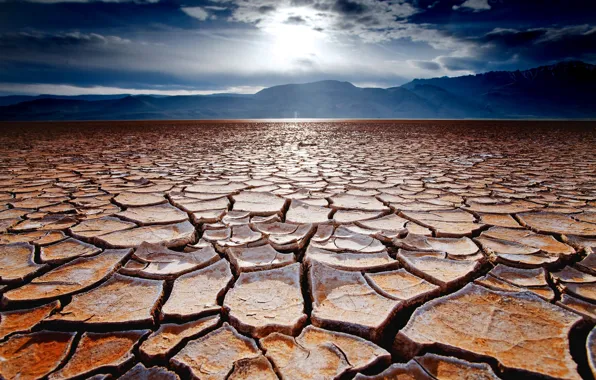 The sky, mountains, cracked, earth, desert, drought