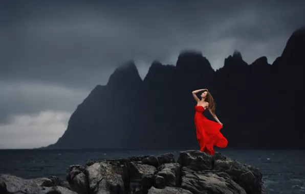 Mood, the ocean, rocks, red dress