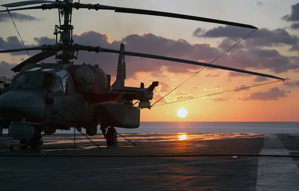 Sea, sunset, helicopter