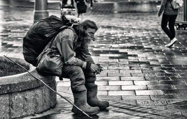 The city, rain, man, homeless, boots, BW