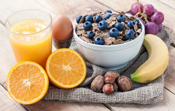 Picture glass, egg, orange, blueberries, juice, grapes, nuts, still life