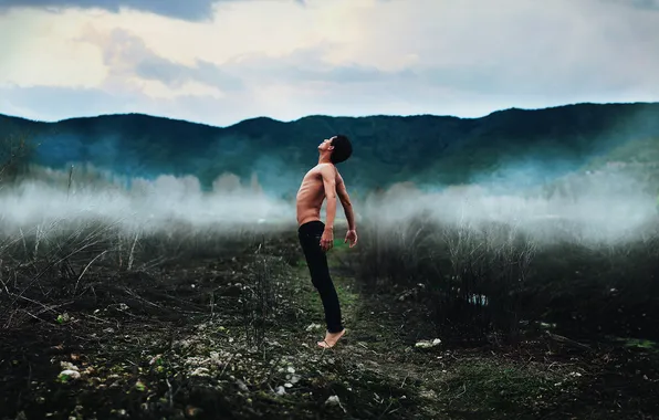 The sky, clouds, mountains, fog, weapons, male, pants