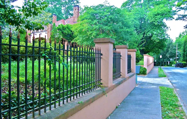Picture the city, street, the fence, home