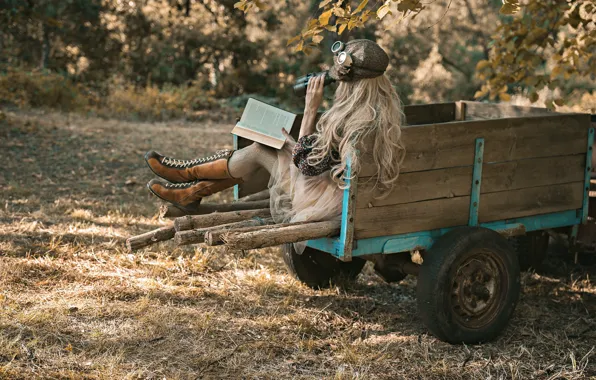 Girl, binoculars, book, cart