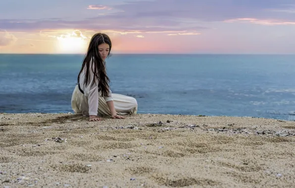 Picture sea, beach, girl, hair, looking at the sand