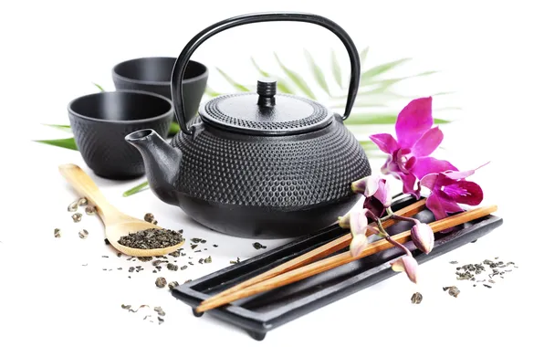 Flower, tea, sticks, kettle, mugs