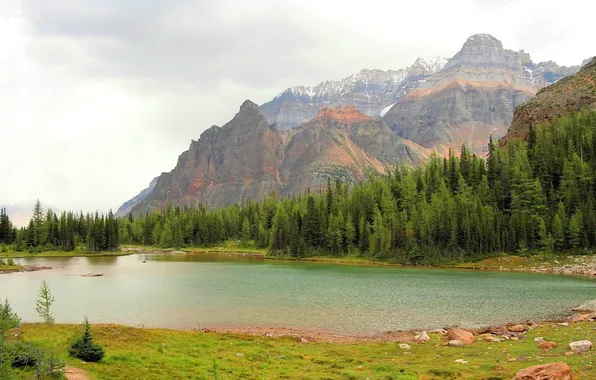 The sky, water, clouds, trees, mountains, landscapes