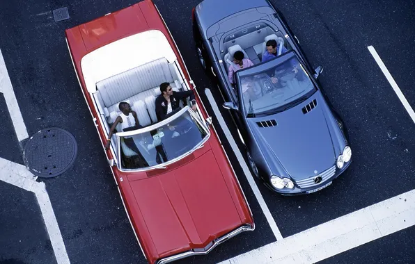 Mercedes, Cadillac, convertibles, at the traffic lights