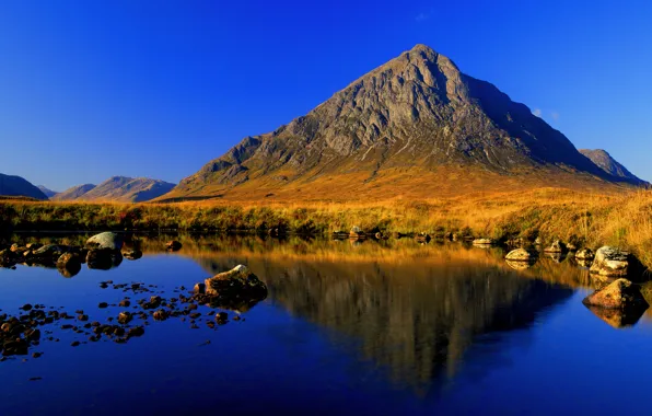 The sky, lake, stones, mountain, pyramid