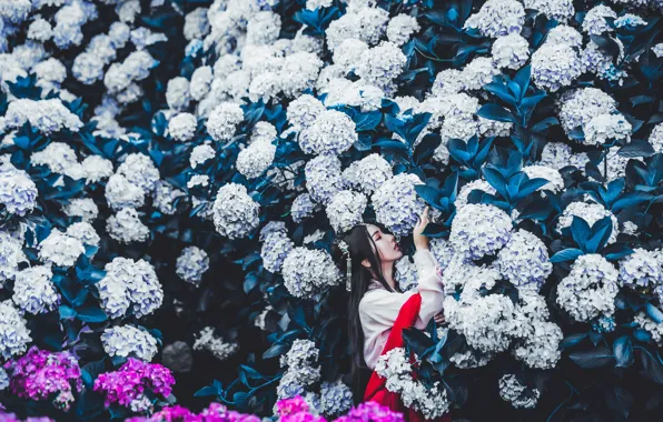 Leaves, girl, flowers, the dark background, garden, dress, brunette, hairstyle