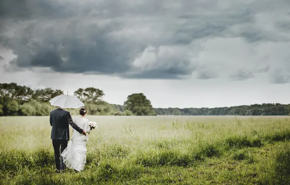 The sky, grass, clouds, umbrella, lovers, two, the bride, the groom