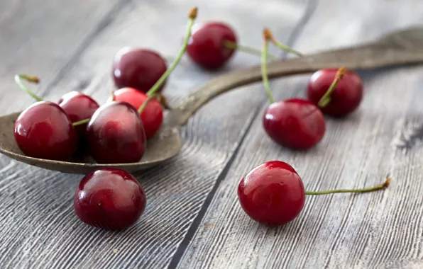 Cherry, berries, spoon