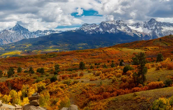 Field, autumn, forest, clouds, snow, mountains, stones, hills